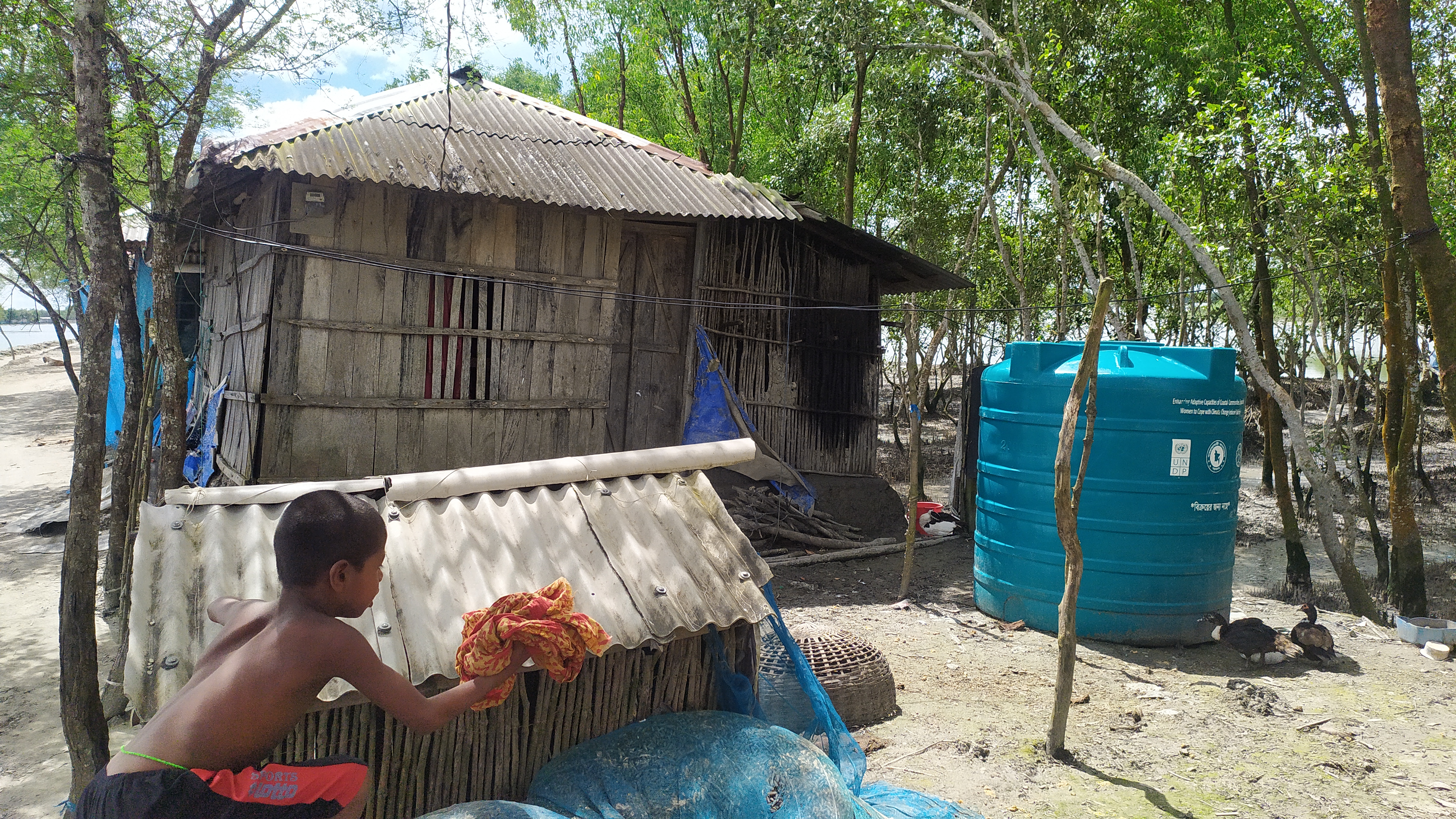 Beneficiary with water intervention in Bangladesh